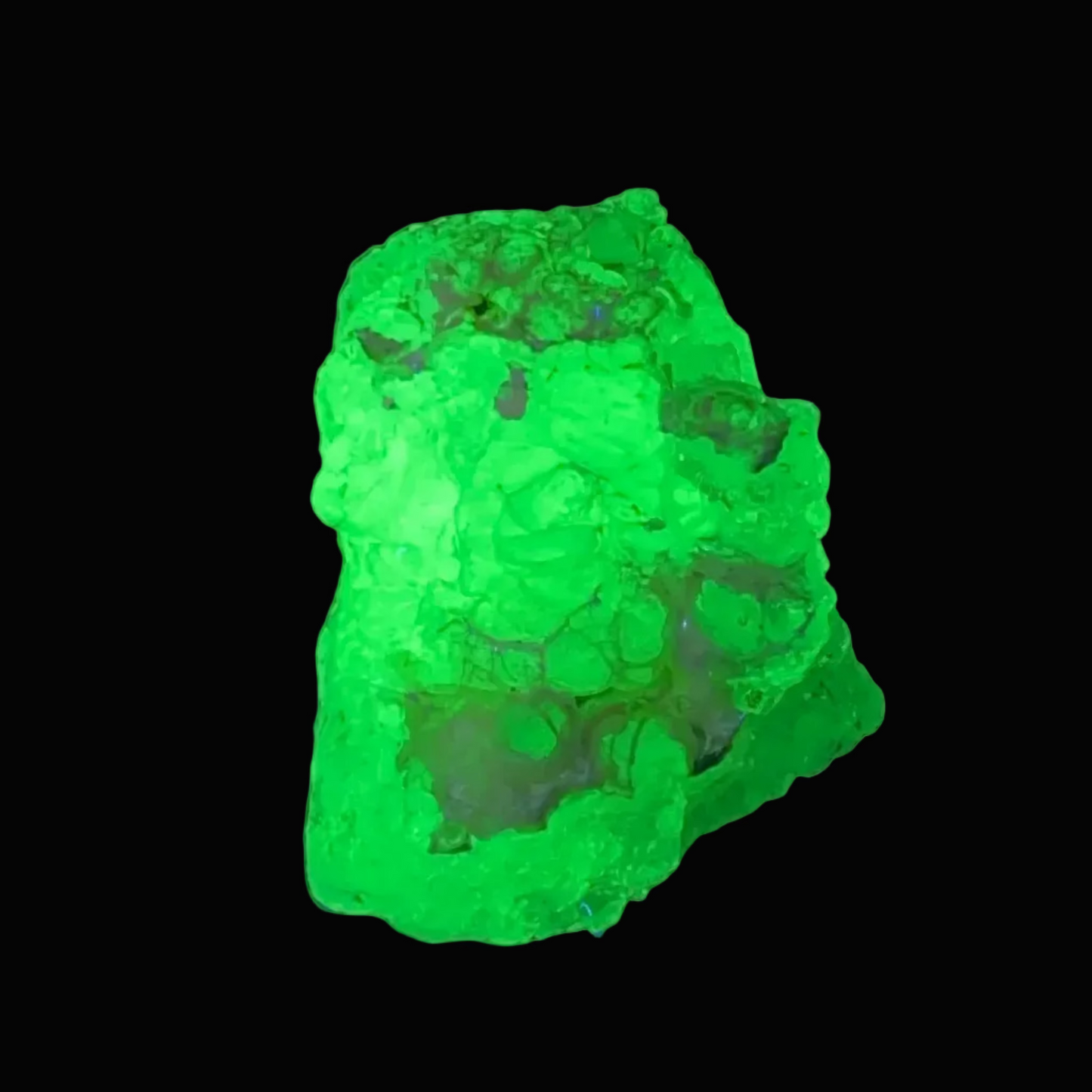 Hyalight opal glowing green under ultraviolet light